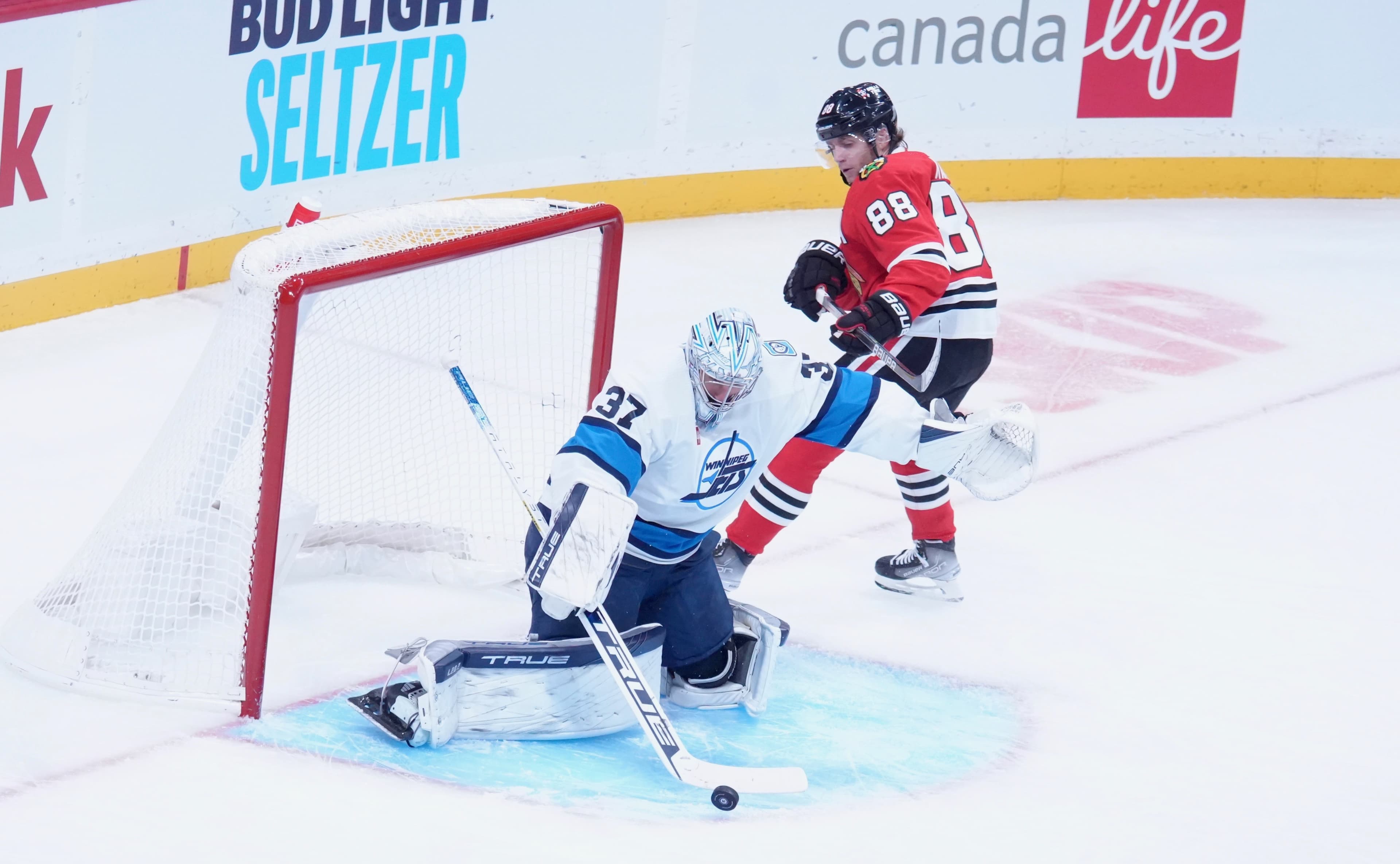 Jets Blast Blackhawks 4-0 as Hellebuyck, Morrissey and Dubois Shine